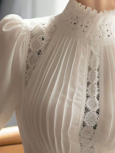 قميص نسائي أبيض بأكمام منفوخة رائج في ربيع 2025 - بلوزة أنيقة بياقة واقفة 